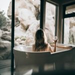A woman sitting on a tub